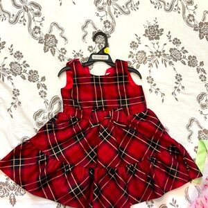 Selling a cute frock which is in red colour suitable for 2 to 3 years kids